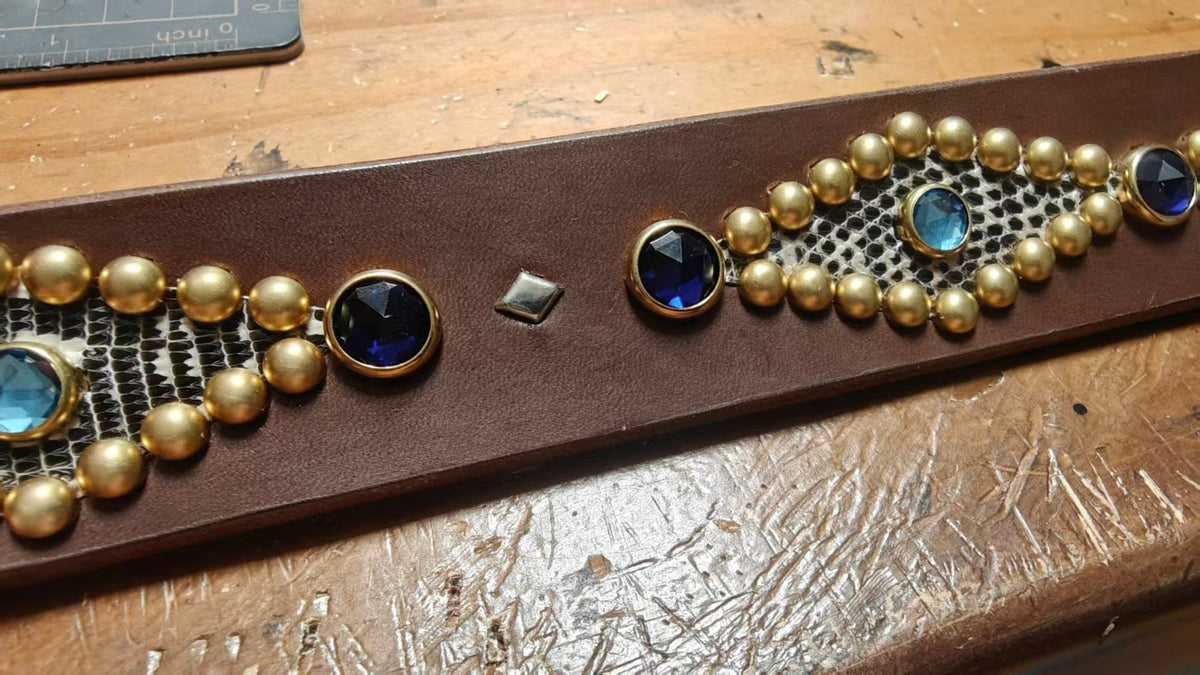 Amarillo Belt: blue jewels, brass studs and lizard inlay, close-up