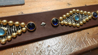 Amarillo Belt: blue jewels, brass studs and lizard inlay, close-up