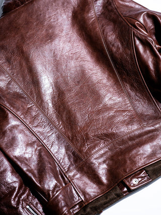 Back panel and belt loops of the brown Archetype D-Pocket jacket, detail