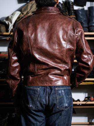 Model wearing the brown Archetype D-Pocket jacket, back view
