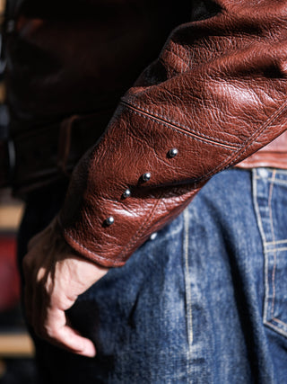 Snug cuff of the brown Archetype D-Pocket jacket, worn