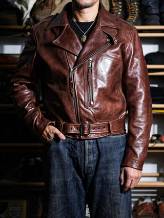 Model wearing the brown Archetype D-Pocket motorcycle jacket, front view