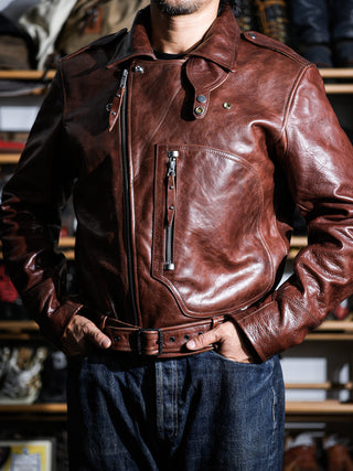 Model wearing the brown Archetype D-Pocket jacket, three-quarter front view