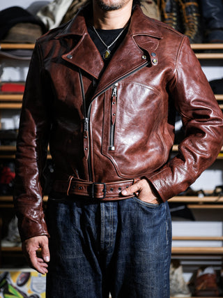 Model wearing the brown Archetype D-Pocket jacket open, showing the wool-blend lining