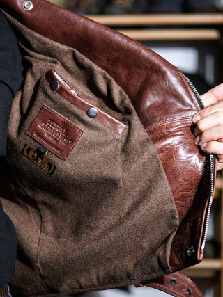 Wool-blend body lining and plaid sleeves of the brown Archetype D-Pocket jacket