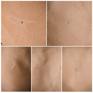 Textured natural leather surface with visible imperfections and natural variations.